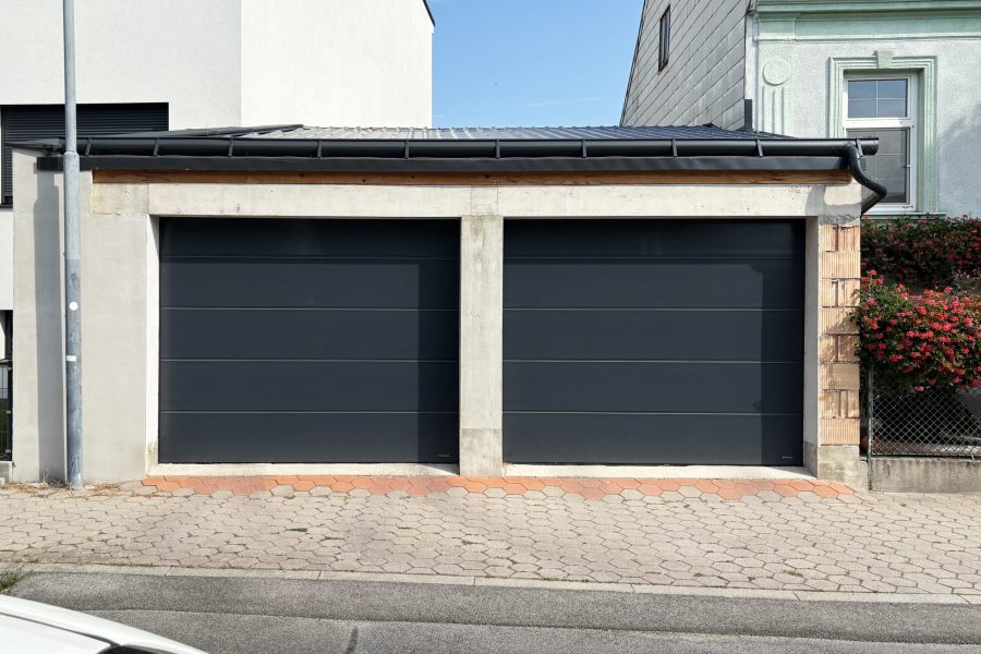 Garagensektionaltor-unipro-snp-ral-7016-elektrischer-antrieb-garagenfenster-primo-nebentuer-doorpro-wien-simmering-10