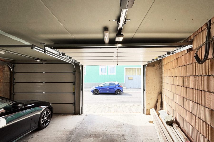 Garagensektionaltor-unipro-snp-ral-7016-elektrischer-antrieb-garagenfenster-primo-nebentuer-doorpro-wien-simmering-11